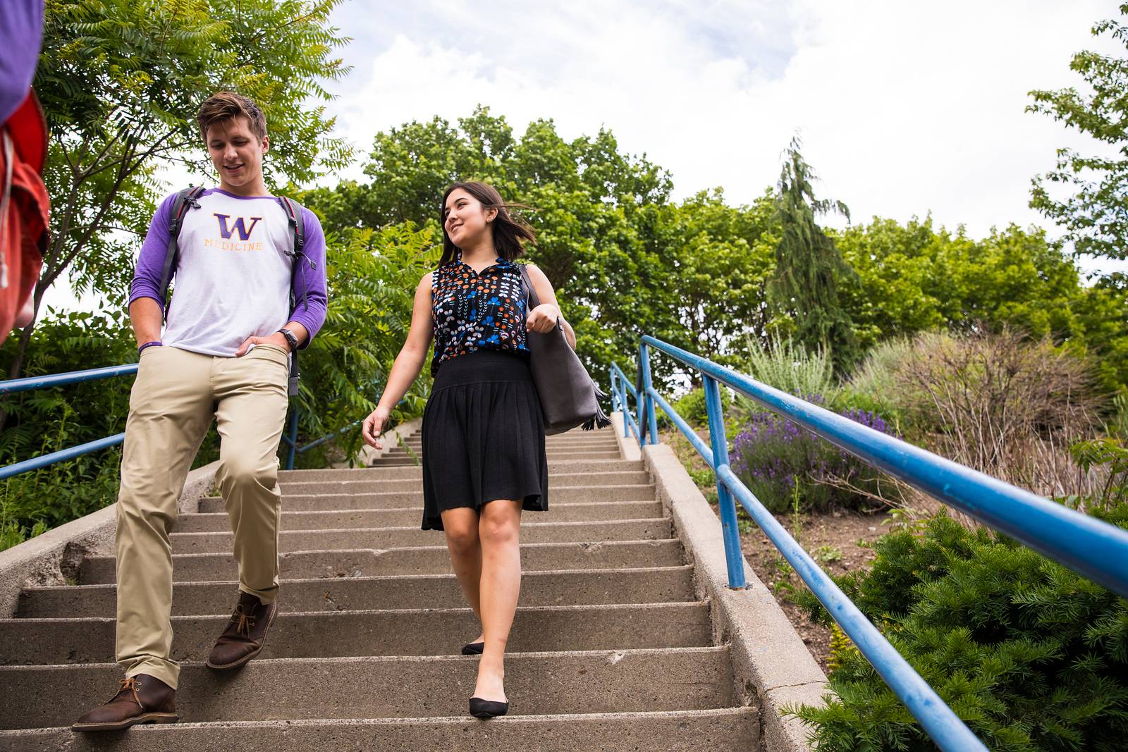 Students walking down campus stairs